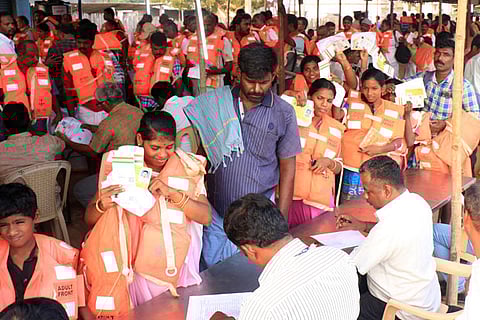 Pilgrims completing formalities before starting to the islet at Rameswaram on Friday