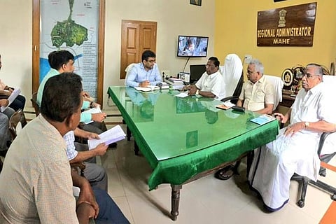 CM and Health Minister Malladi Krishna Rao holding talks with the officials of the district administration