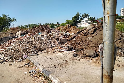 Mounds of debris piled up at river banks