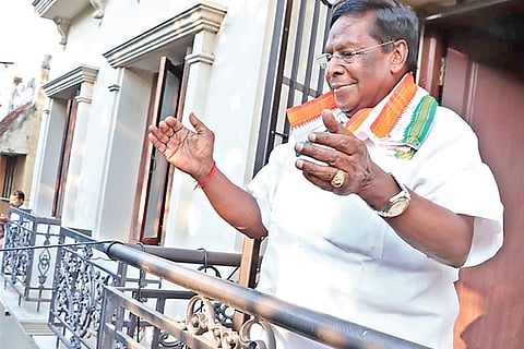 Chief Minister V Narayanasamy (right) claps his hands to applaud the health employees