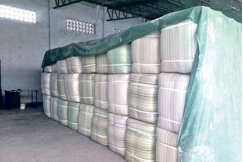 Bundles of mosquito nets piled up in a Karur unit