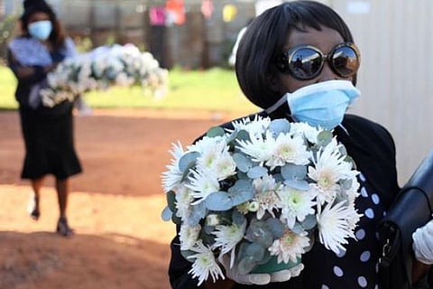 South Africans mourn a metre apart as COVID-19 curbs funerals