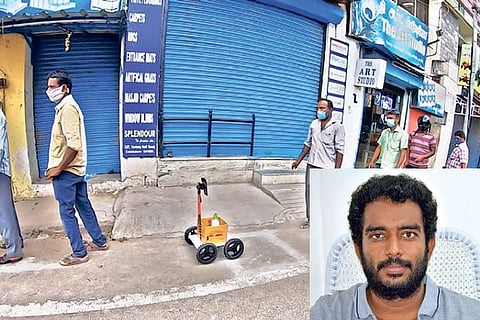 The robot in queue outside a liquor store, (Inset) V Karthick