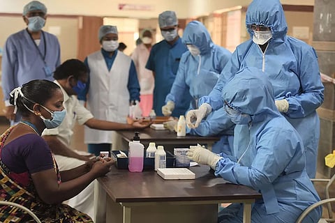 Medics take samples for rapid test at Rajiv Gandhi Government General Hospital in Chennai