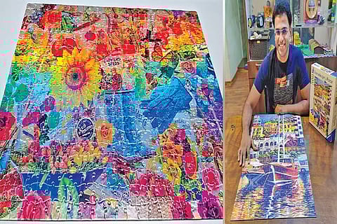 Garden collage foil puzzle; Senthilnathan with a puzzle he has completed