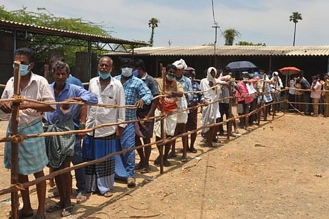 Tipplers brave TN heat in helmets, masks as liquor outlets open