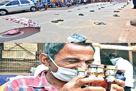 Footwear placed by tipplers in circles drawn outside a Tasmac shop; customer kisses liquor bottles