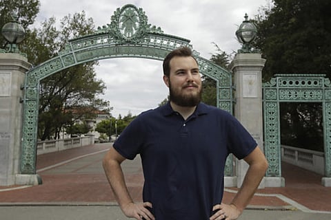 University of California at Berkeley graduate Tyler Lyson stands in front of Sather Gate