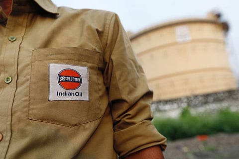 File Photo: An Indian Oil tanker driver waits outside a fuel depot in Mumbai
