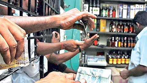 Tipplers seeking brands of their choice at a Tasmac shop (file photo)
