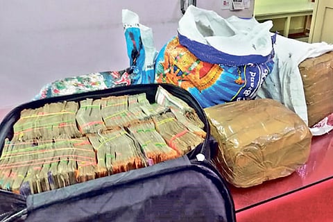 The seized cash and ganja from a house near Ambur town on Tuesday