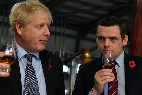 Boris Johnson along with Douglas Ross: Image Courtesy - Reuters