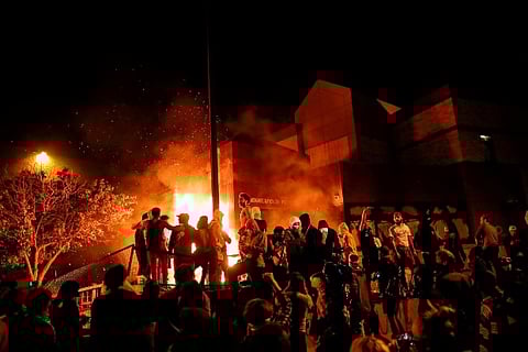 Racially charged violence rages for third night in Minneapolis