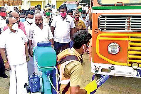 Minister Kadambur Raju inspecting lorries that transport matchboxes being disinfected at Kovilpatti