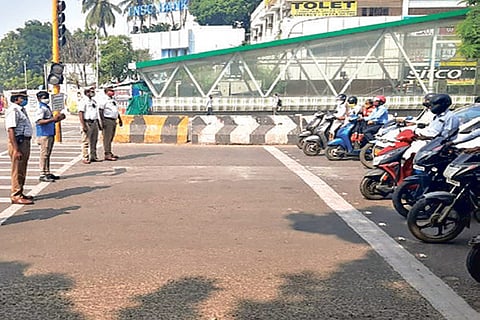 Cops during an awareness drive at a traffic signal
