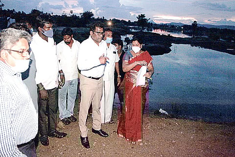 Collector KS Kandasamy and AICI CMD Poddar signing the MoU on the shores of the Devananthal tank