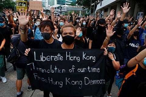 Hong Kong's pro-democracy lawmakers threaten to resign