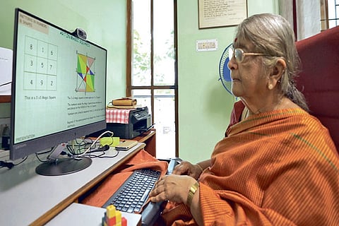 Saroja working on the website she created