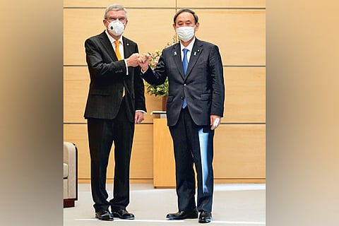 IOC President Thomas Bach and Japan prime minister Yoshihide Suga in Tokyo on Monday