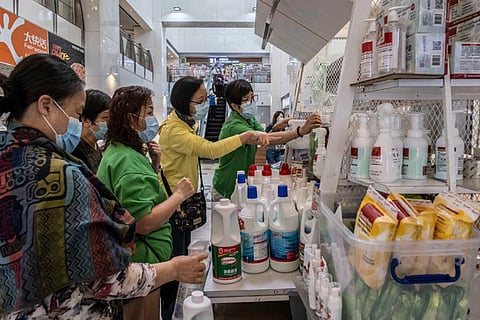 People buying disinfectant at a shopping mall in Hong Kong