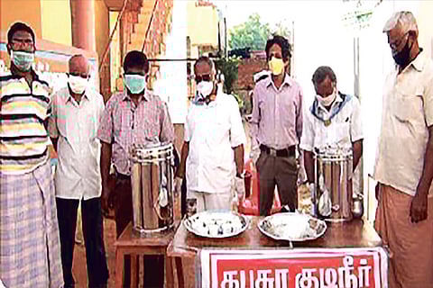 Volunteers of Sathya Sai Seva offer kabasura kudineer to healthcare workers and public