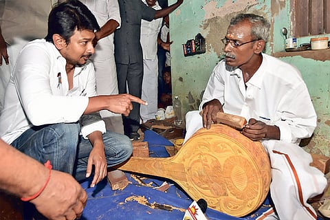 Udhayanidhi Stalin interacts with a Veena maker on Monday