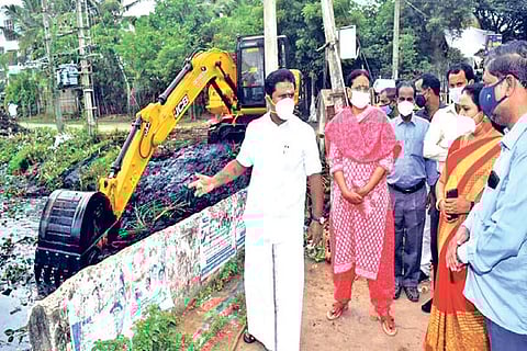 Minster R Kamaraj inspecting cleaning of a stormwater drains in Tiruvarur on Tuesday