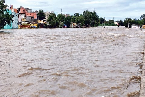 A view of Goundanyamahanadhi, which runs across Gudiyattam town, in spate on Friday