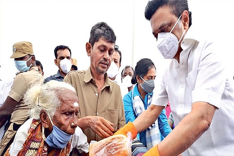 DMK president MK Stalin distributing relief materials for the third day in Chennai on Friday
