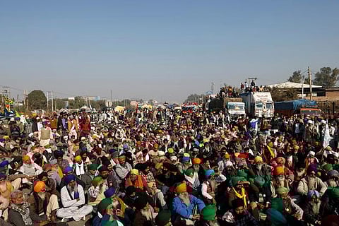 Indian farmers defiant against reform as Modi tries to calm anger