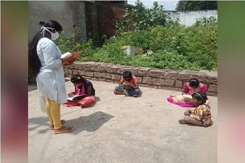 Source: ANI; A Vidya Volunteer teaching students following COVID-19 norms in Hyderabad.
