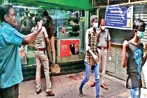 Police arresting the gang members who vandalised a supermarket in Thousand Lights on Thursday