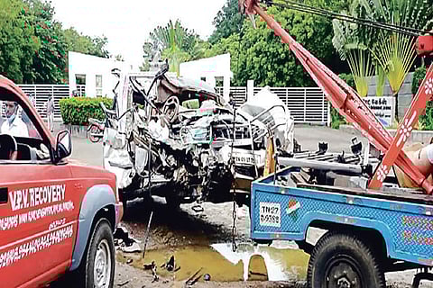 Mangled remains of the ill-fated car being removed