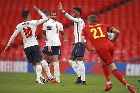 Marcus Rashford, second from right, celebrates England?s equaliser with fellow Mason Mount