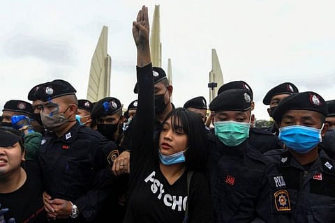 Thai protest arrests draw chants as royal motorcade passes