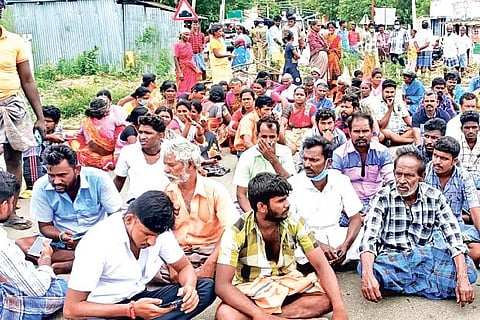 Relatives of the victim and villagers block road at Soolapuram near Peraiyur in Madurai on Wednesday