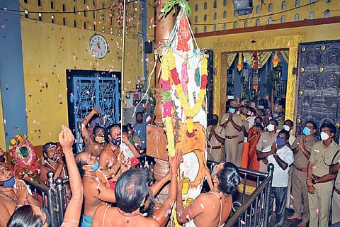 The flag being hoisted at the Mutharamman temple on Saturday