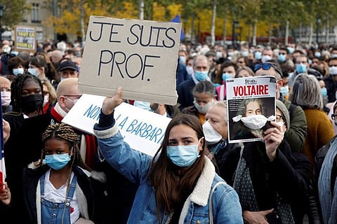 'Teaching yes, bleeding no': France pays tribute to beheaded teacher