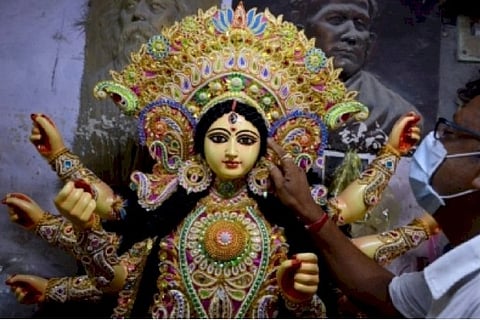 Low-key Durga idol immersion in Ichamati river under COVID shadow