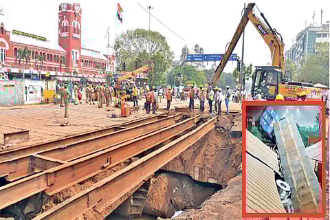 A portion of the road in front of the Central railway station caved in; (Inset) The truck that fell