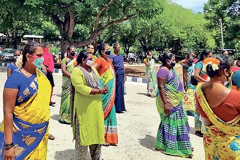 Transpersons who live in Natarajapuram village assembled to return land patta on Monday