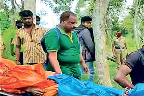 The body of the woman killed in the tiger attack being taken out of the forest in The Nilgiris