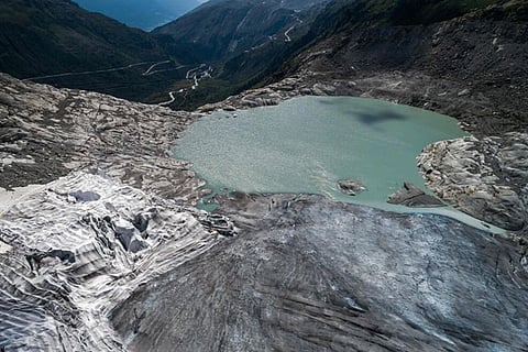 A glacial lake at the end of the Rhone Glacier, near Gletsch, Switzerland.