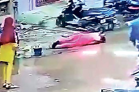 A grab of the video which shows a woman lying in the stagnant waters after suffering electric shock