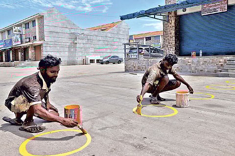 Markings being made for social distancing at the grocery division of the wholesale market