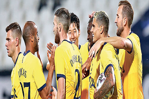 Tottenham Hotspur players celebrate their win in Europa League