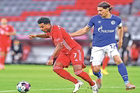 Bayern Munich winger Serge Gnabry (left) was the star of the show against Schalke, netting 3 goals