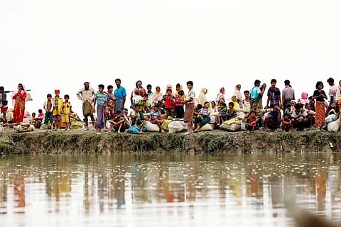Rohingya refugees waiting for a boat to cross Myanmar's border.