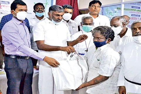 Minister Veeramani and Vellore DRO J Parthiban give away grocery at a function organised by CSI