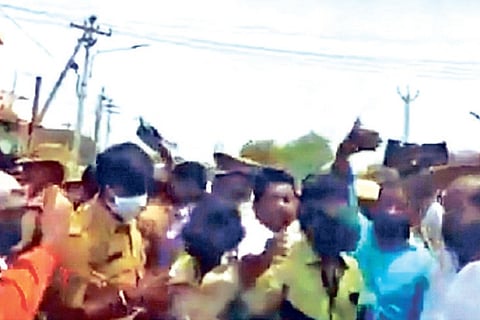 Video grab of protest by AIADMK workers against DMK candidate Karthikeya Sivasenapathy